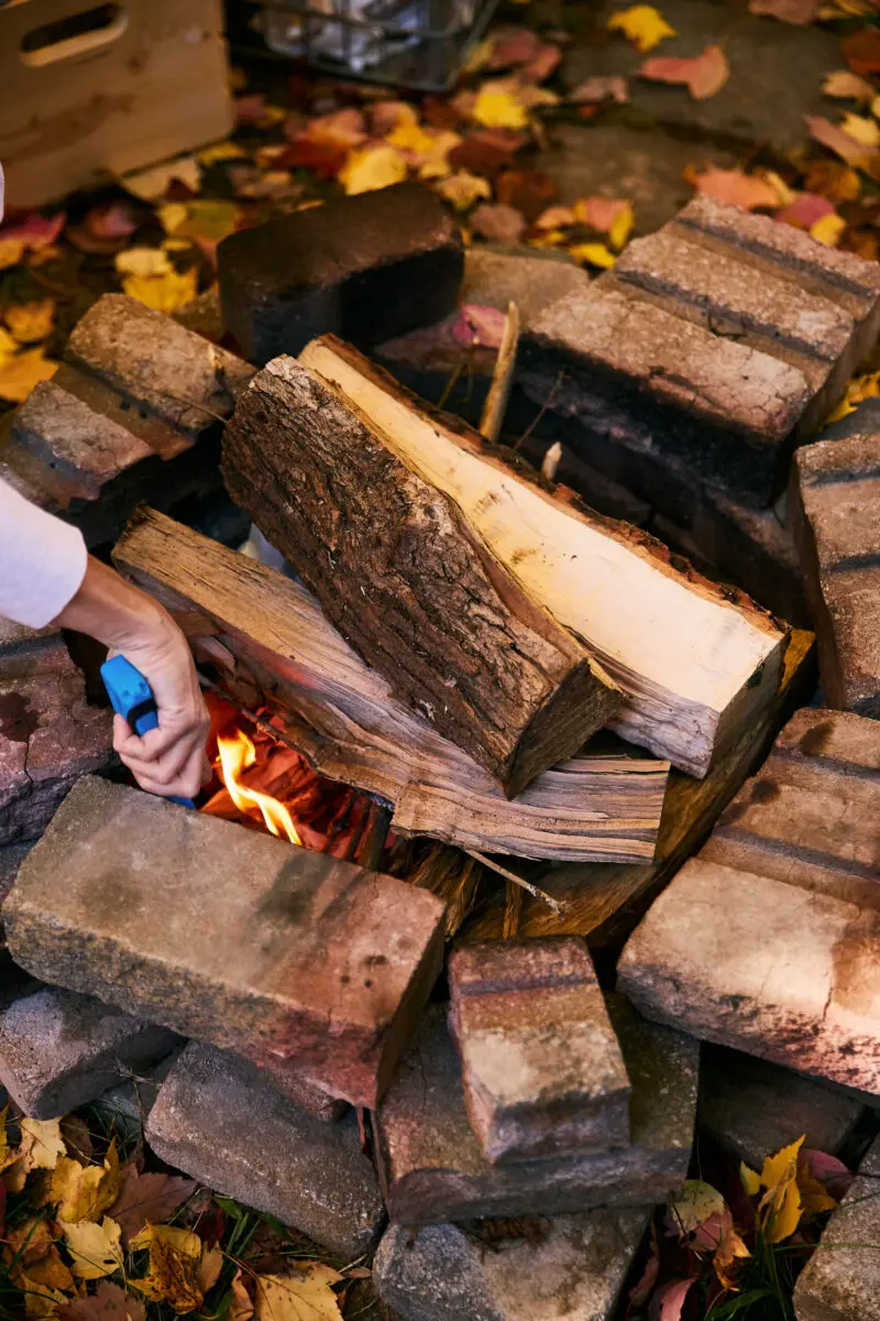 flames drawing air up through a stacked campfire, showing draft and airflow