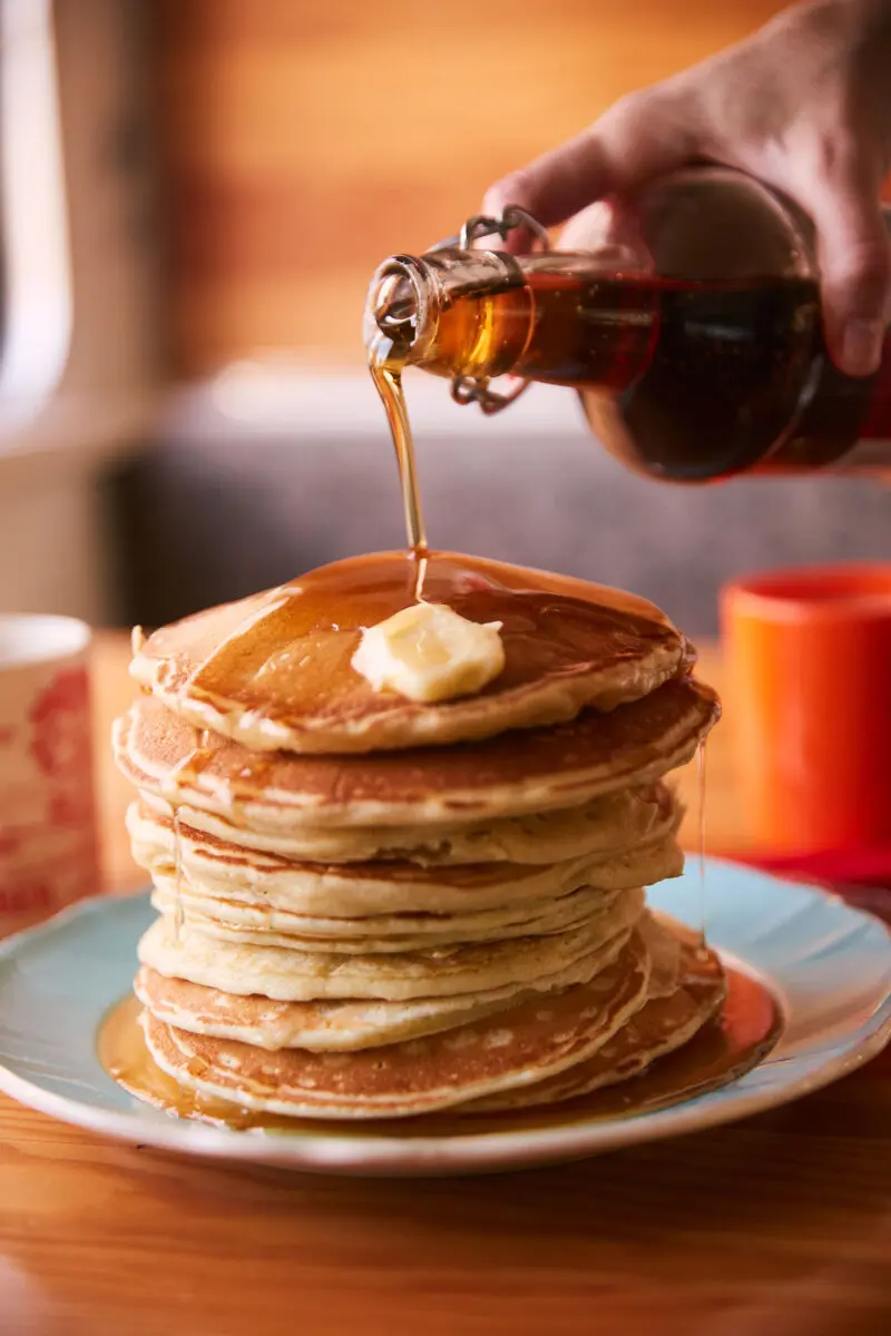 Cowboy Campfire Pancakes: From-Scratch Batter on Cast Iron 1 Cowboy campfire pancakes cooking in a cast iron pan over a fire